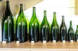 An array of wine bottles in different sizes