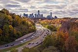 A highway with a city in the distance