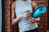 A woman building good habits getting fit and eating healthy foods