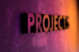 The word “Projects” embossed on a purple background.