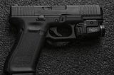 Glock 45 handgun with under barrel light