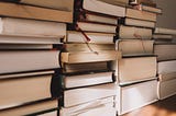 Several stacks of books with bookmarks