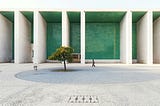 Photo of a courtyard in front of a building with pillars, by José Duarte on Unsplash