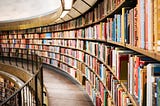 Curved rows of bookshelves in a library