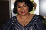 Photo of April Ryan in her stunning attire.