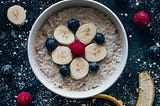 Oatmeal with bananas, grapes and strawberries