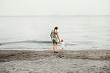 mom and her kid on the beach