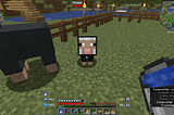 A small black sheep in Minecraft looking at you