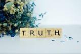 Scrabble letters spelling the word “Truth”