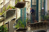 Picture of an old guy standing on his balcony via Alt text on Medium