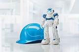 An_image_of_a_robot_and_a_safety_helmet
