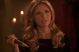 Buffy Summers holds a wooden stake