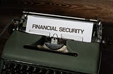 A typwriter with a page in it with a heading as Financial Security