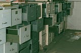 a photo of stacked old metal filing cabinets