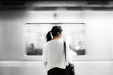 a subway train passing a person by