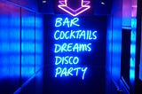 Neon sign in a bar, cocktails, dreams, disco party
