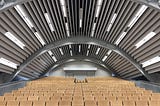 An empty auditorium: is the future of events a firm hybrid between physical and virtual?