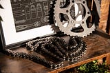 Conveyor chain and gear on a wooden platform