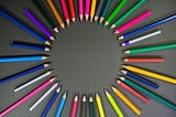 multicolored pencils arranged in a circle