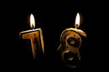 Birthday candles, a 1 and an 8