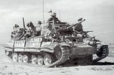 Valentine tank in the western desert carrying troops