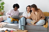Three flatmate sitting on couch and talking