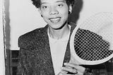 Althea Neale Gibson holding a tennis rocket.