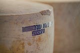 A big wheel of parmesan cheese indicating that this story is about Italian food.