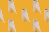 A marigold yellow background with repeated images of toilet paper rolls that are on its last legs