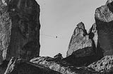 A high wire between two huge rocks