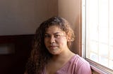 Portrait of Latina woman representing patients that benefit from genetic testing for hereditary cancer risks — Invitae blog