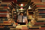 photo of a young woman framed by a circle of library books