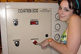 Young woman in a bikini about to press the “Immanentize” button on a machine labelled the “Eschatron 9000.”