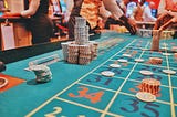 Craps table in casino with stacks of chips