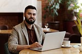 Man working online in a cafe