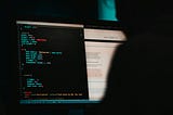 Someone programming a website in HTML. But also a photo suitable for hackers. ;) 