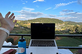 view of laptop and mountainous valley