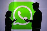 Two people: A man and a woman standing with WhatsApp logo in the background.