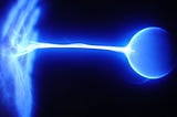 A blue energetic structure of a hand transmits a blue energy ball with an energetic cord attaching the hand and ball together with a black background.