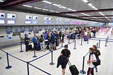 Airport picture showing passengers in a queue