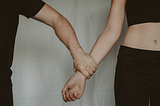 A man holding a woman’s arm