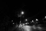 empty road at night with street lamp