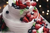 berries on a white cake