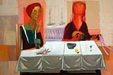Orange woman at a table. Abstract art.