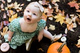 How To Get Perfect Pictures of Your Baby In a Pumpkin Patch