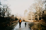 Guy walking with a dog