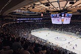 A view of a hockey ring from the upper corner of the stadium