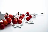 Christmas ornaments lying on the floor red and white.