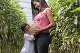 A child kissing the womb from which he was born.