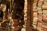 Books stacked high in modern-day Iraq